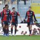 Giocatori del Genoa in campo durante una partita